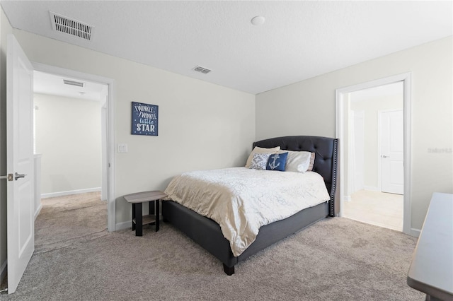 bedroom with light carpet