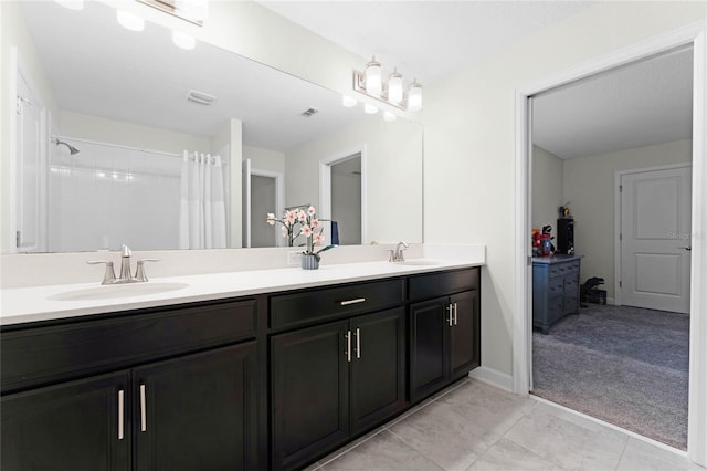 bathroom with a shower with shower curtain and vanity