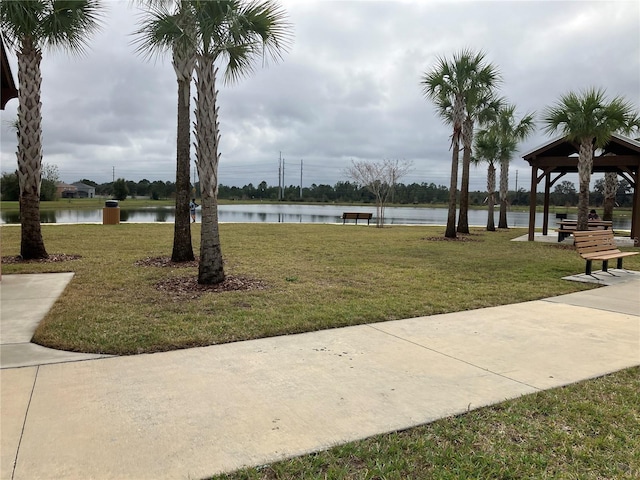 view of community featuring a gazebo, a lawn, and a water view