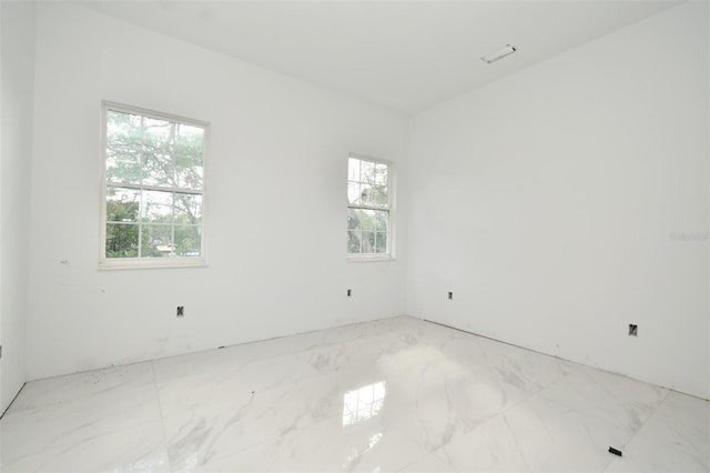 unfurnished room with a wealth of natural light