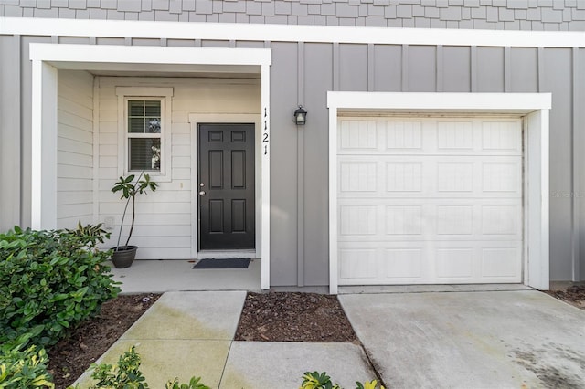 view of exterior entry featuring a garage