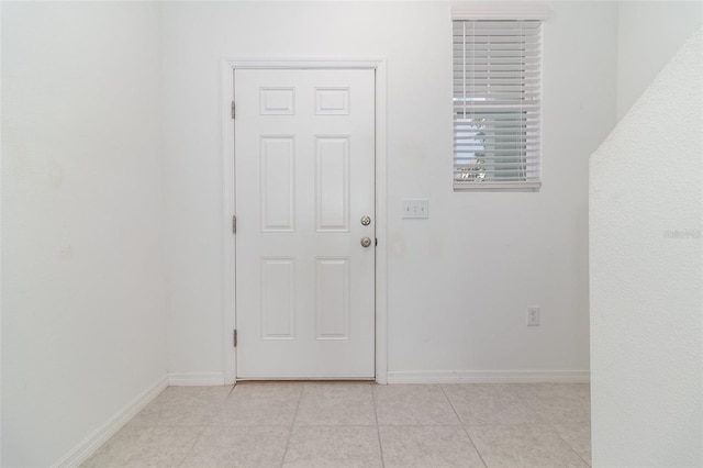 entryway featuring light tile patterned flooring