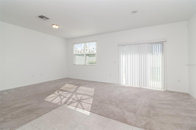 empty room with light colored carpet