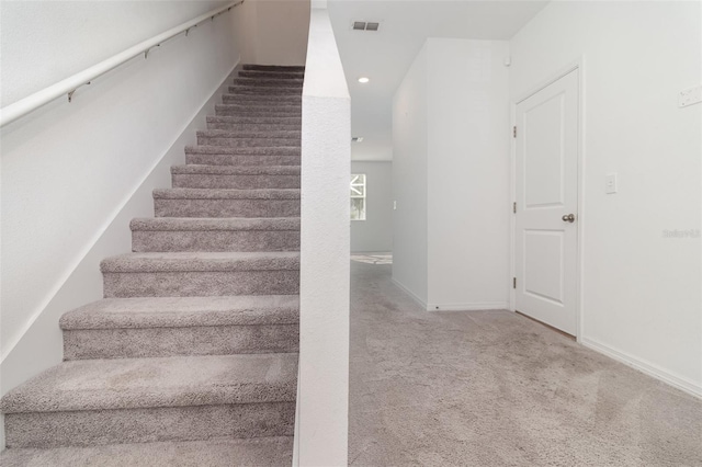 stairway with carpet flooring