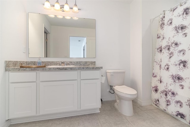 bathroom featuring tile patterned floors, vanity, a shower with shower curtain, and toilet