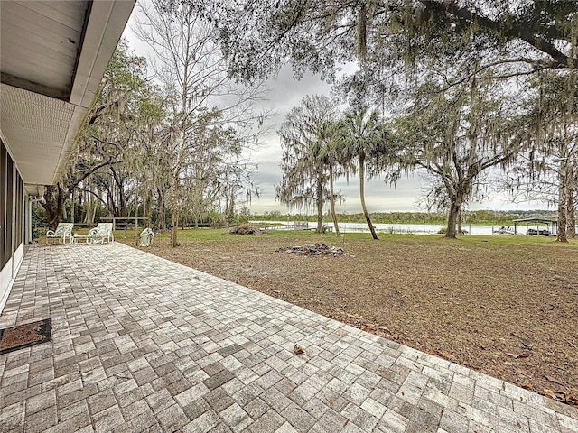 view of patio featuring a water view