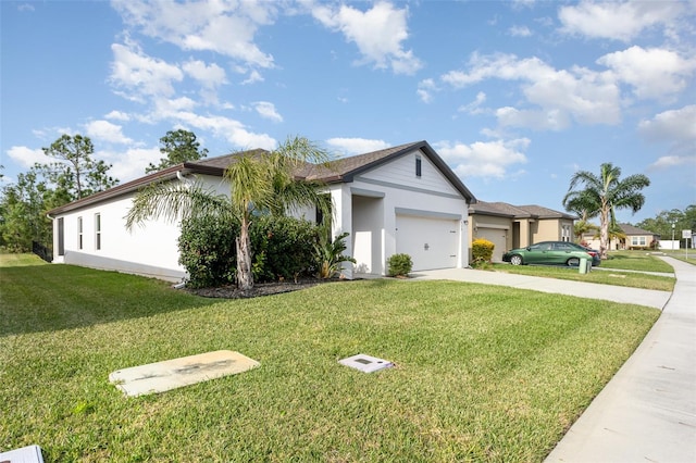 ranch-style house with a garage and a front lawn