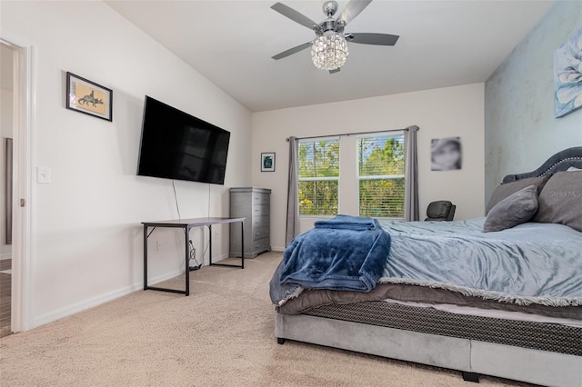 bedroom with ceiling fan and light carpet