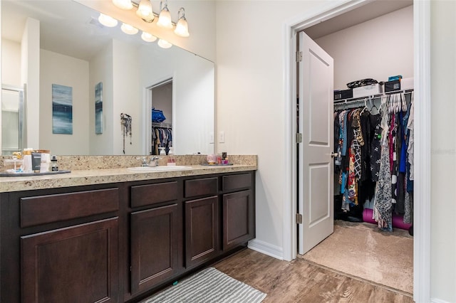 bathroom featuring vanity and hardwood / wood-style flooring