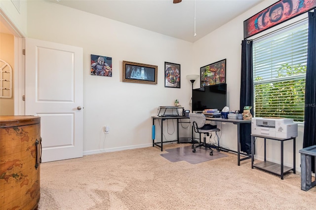 home office featuring ceiling fan and light colored carpet