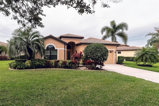 mediterranean / spanish house with a front yard and a garage