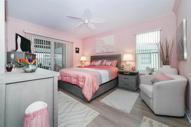 bedroom featuring access to outside, ceiling fan, ornamental molding, and light wood-type flooring