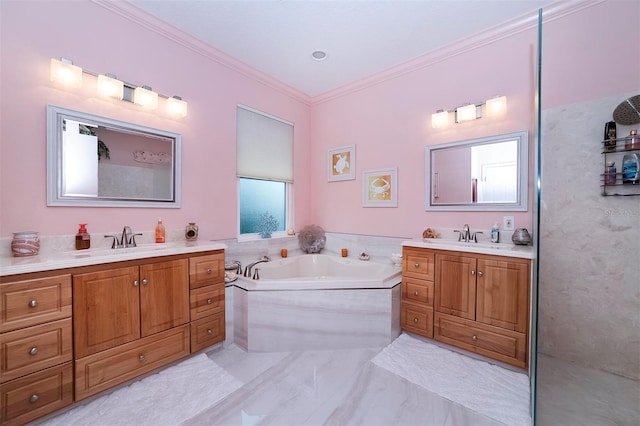 bathroom with a washtub, vanity, and ornamental molding