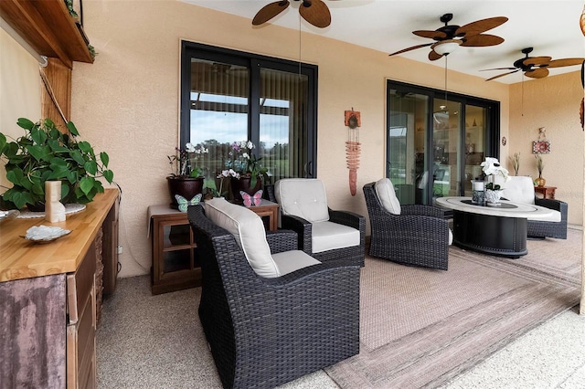 view of patio featuring ceiling fan