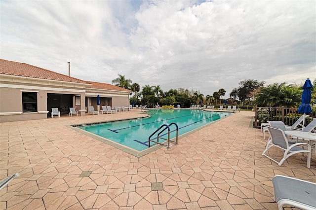 view of swimming pool with a patio area