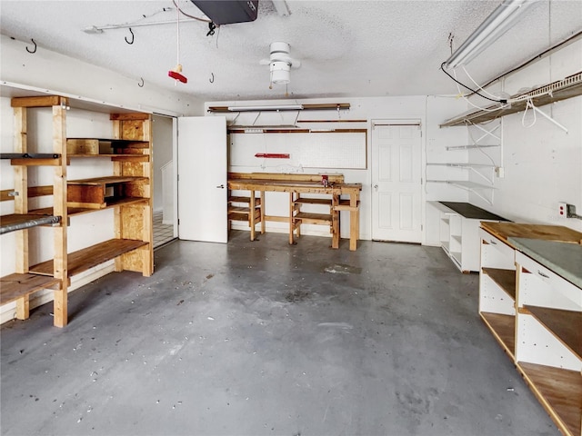 basement featuring a workshop area and a textured ceiling