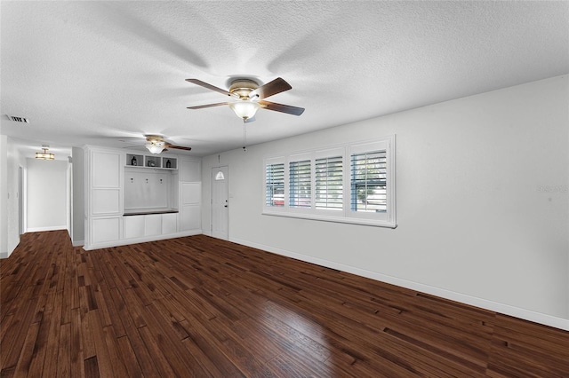 unfurnished living room featuring ceiling fan, hardwood / wood-style floors, and a textured ceiling