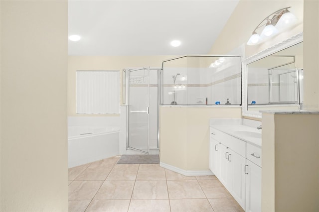 bathroom featuring shower with separate bathtub, vanity, and tile patterned floors