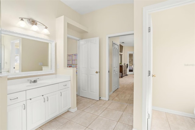 bathroom featuring tile patterned flooring and vanity