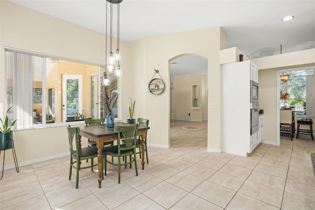 dining space with light tile patterned floors