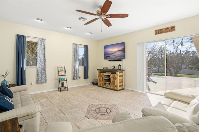 tiled living room featuring ceiling fan