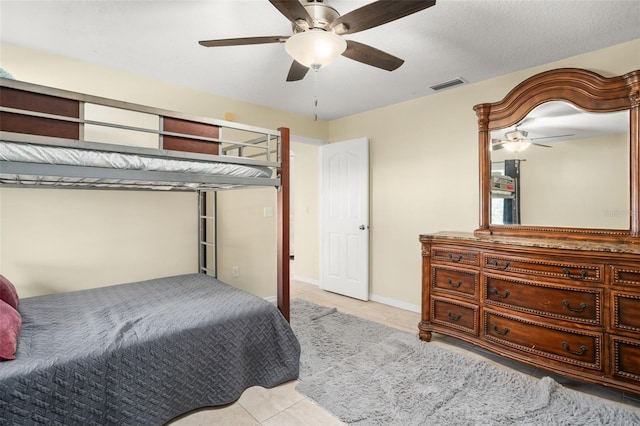 bedroom featuring ceiling fan and light tile patterned floors