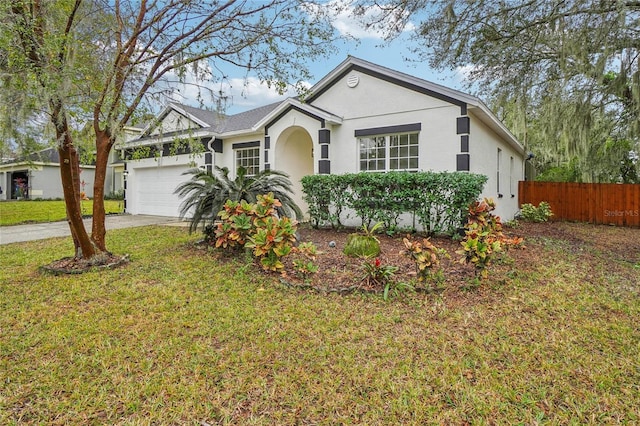 ranch-style house with a front yard and a garage