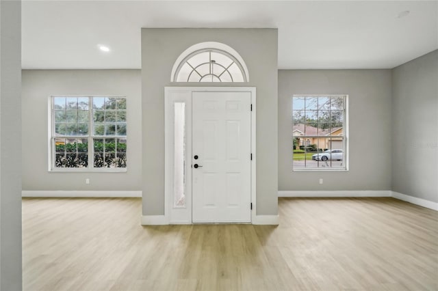 entryway with light hardwood / wood-style floors