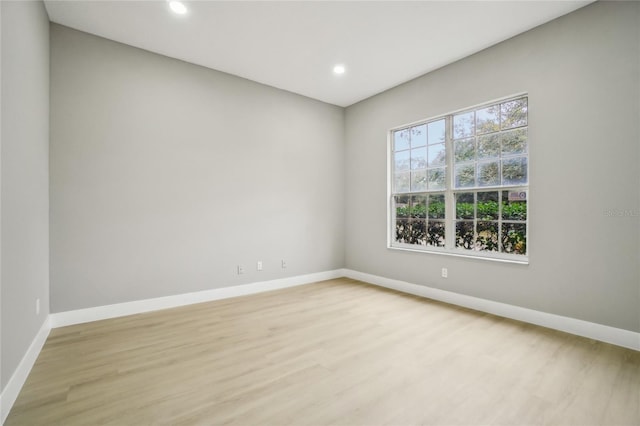 spare room featuring light wood-type flooring