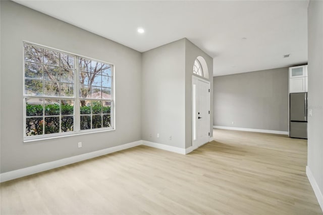 unfurnished room featuring light hardwood / wood-style floors