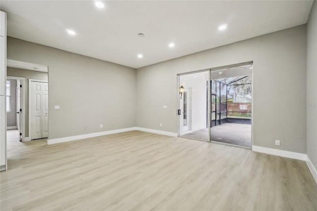 spare room featuring light hardwood / wood-style floors