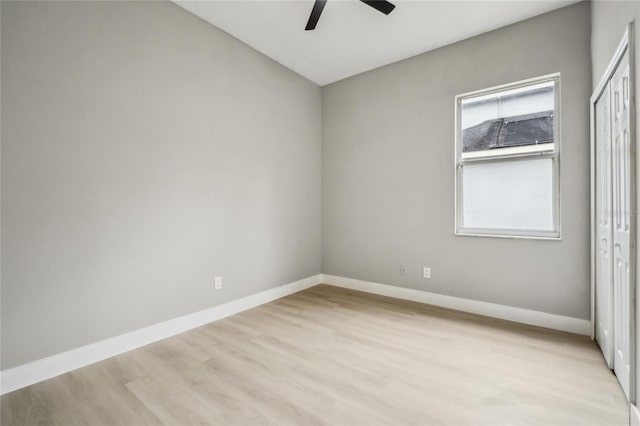 unfurnished room with ceiling fan and light wood-type flooring