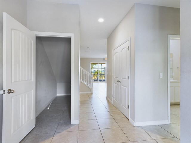 hallway featuring light tile patterned floors