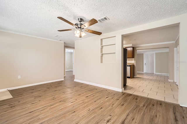 unfurnished room with a textured ceiling, light hardwood / wood-style flooring, built in features, and ceiling fan