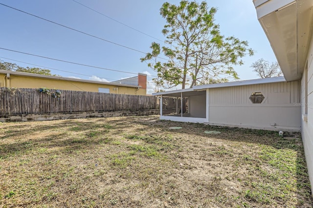 view of yard featuring a sunroom