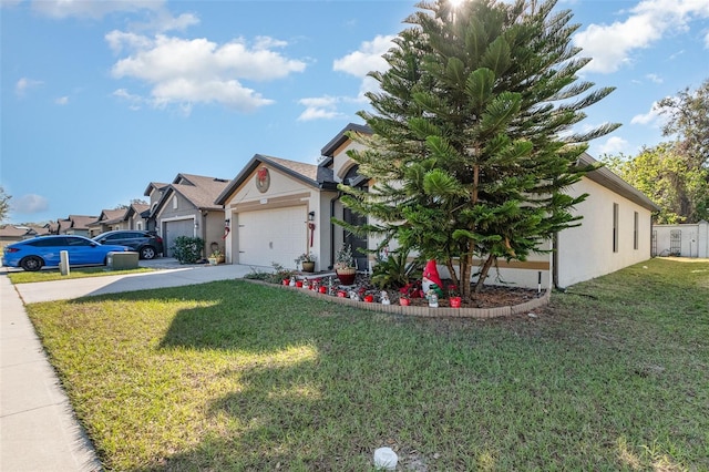 view of front of home featuring a garage and a front lawn