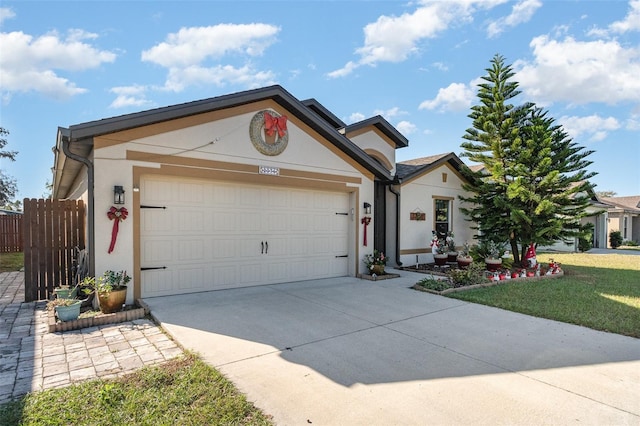 single story home with a front lawn and a garage