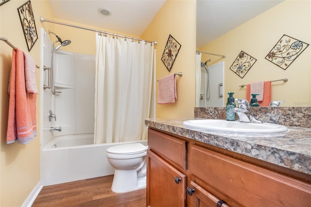 full bathroom featuring hardwood / wood-style floors, vanity, toilet, and shower / bathtub combination with curtain