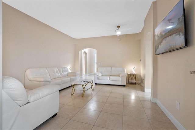 tiled living room featuring ceiling fan