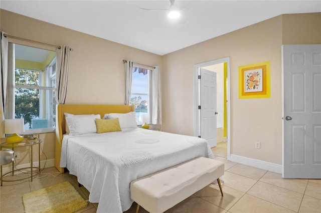 tiled bedroom with ceiling fan