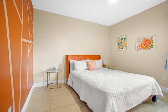 bedroom with light tile patterned floors