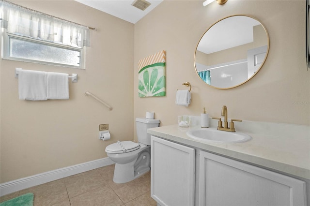 bathroom featuring walk in shower, vanity, toilet, and tile patterned flooring