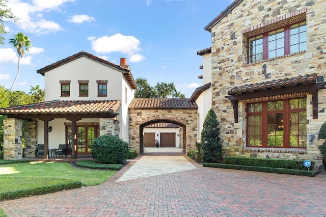 view of front of property with french doors and a front yard