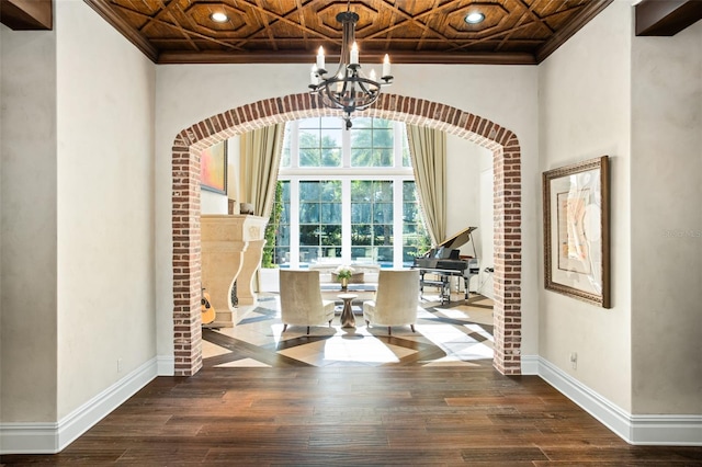 unfurnished dining area with hardwood / wood-style flooring, crown molding, and coffered ceiling