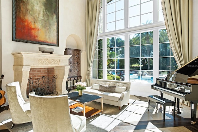 living area featuring a high end fireplace and tile patterned floors