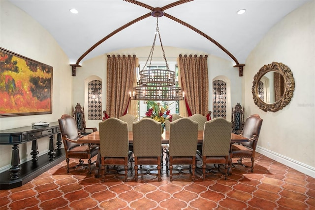 dining area with vaulted ceiling