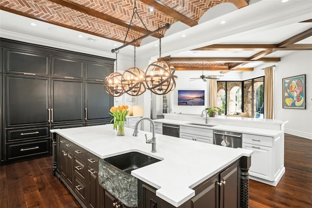 kitchen with brick ceiling, a spacious island, sink, dishwasher, and white cabinetry