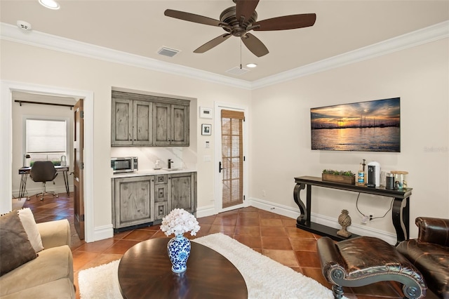 tiled living room featuring ceiling fan and crown molding