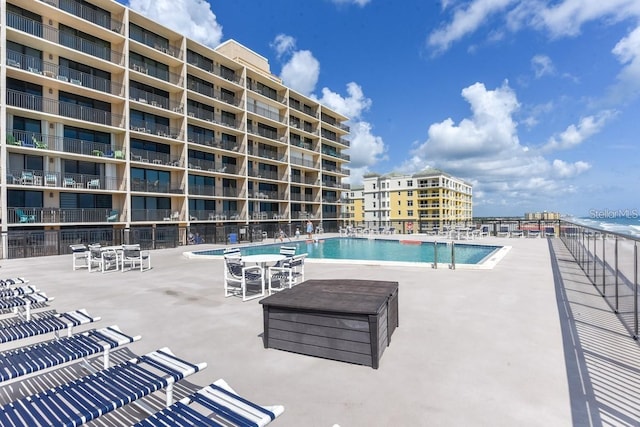 view of swimming pool featuring a patio area