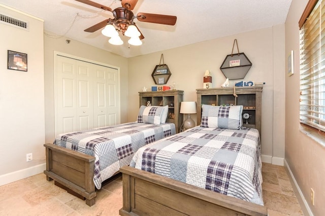 bedroom featuring ceiling fan and a closet